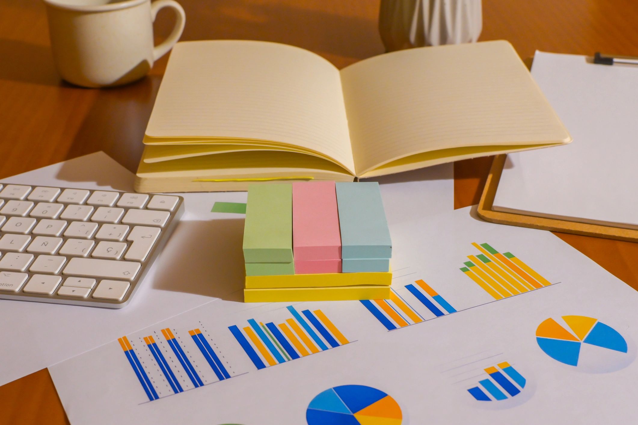 Desk with charts and notes representing refinancing analysis